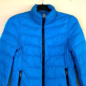 NWOT. Ladies Fabletics bright blue jacket.